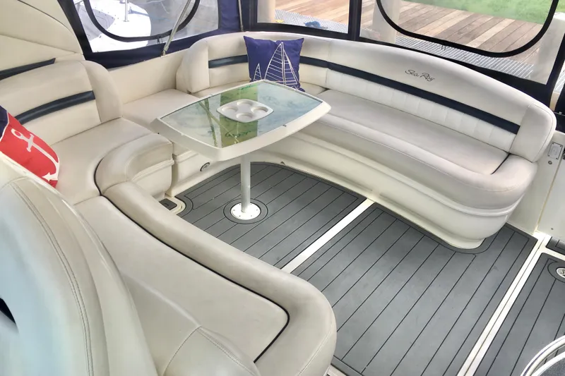  Yacht Photos Pics Luxurious interior of 2005 Sea Ray 420 Sundancer with elegant seating and table.