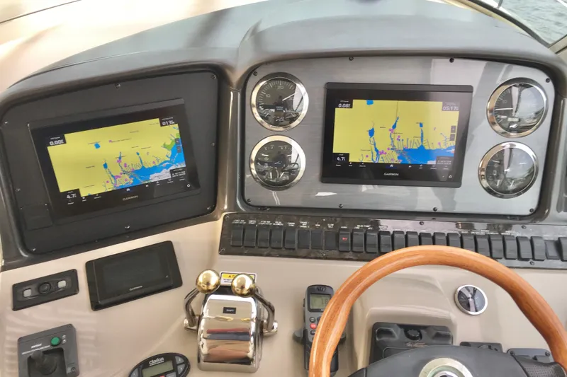  Yacht Photos Pics Dashboard of 2005 Sea Ray 420 Sundancer with navigation screens and controls.