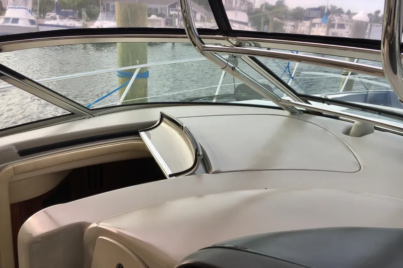  Yacht Photos Pics 2005 Sea Ray 420 Sundancer cockpit view with marina background.
