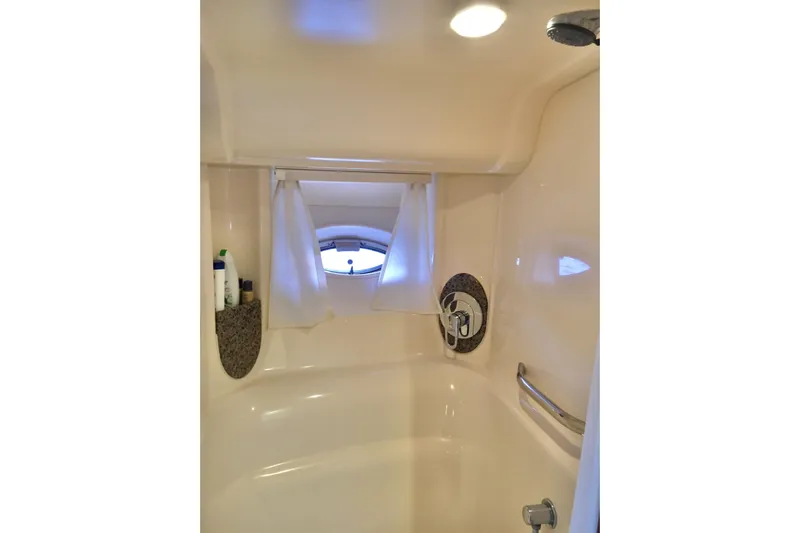  Yacht Photos Pics Bathroom interior of 2005 Sea Ray 420 Sundancer yacht with shower and porthole window.