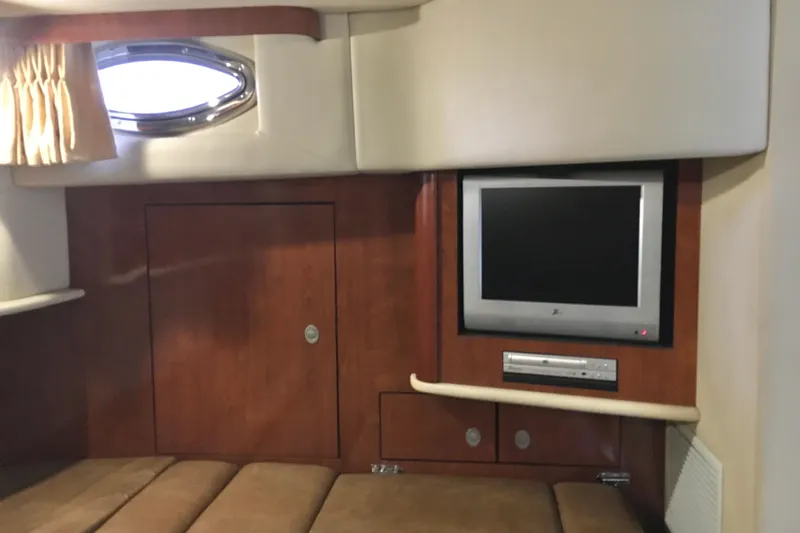  Yacht Photos Pics Interior of 2005 Sea Ray 420 Sundancer with TV and wooden cabinetry.