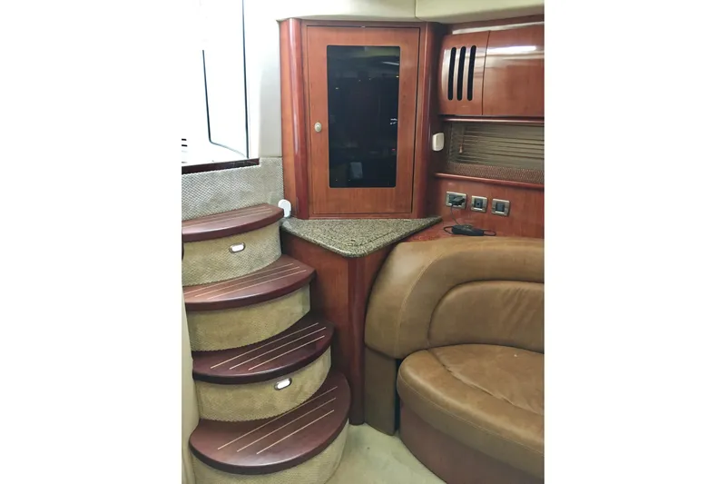  Yacht Photos Pics Interior of 2005 Sea Ray 420 Sundancer with wooden stairs and leather seating.