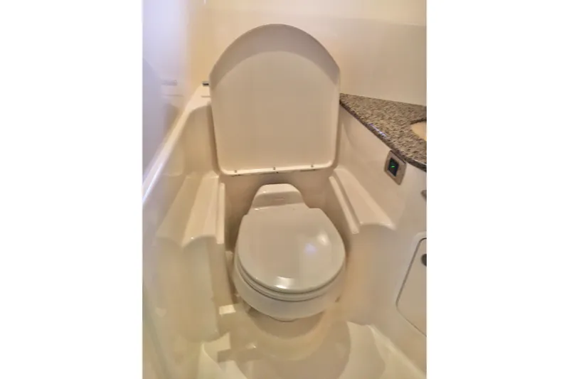  Yacht Photos Pics 2005 Sea Ray 420 Sundancer yacht bathroom with modern toilet and granite countertop.