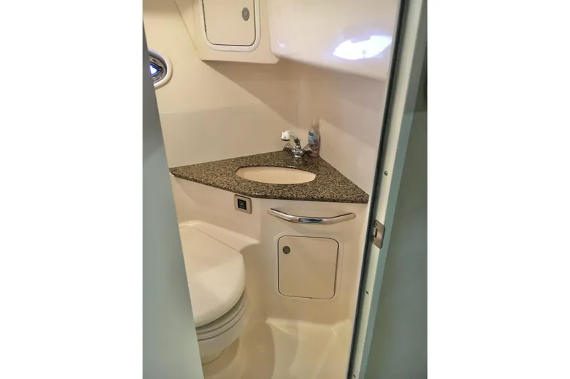  Yacht Photos Pics 2005 Sea Ray 420 Sundancer bathroom with granite countertop and compact design.