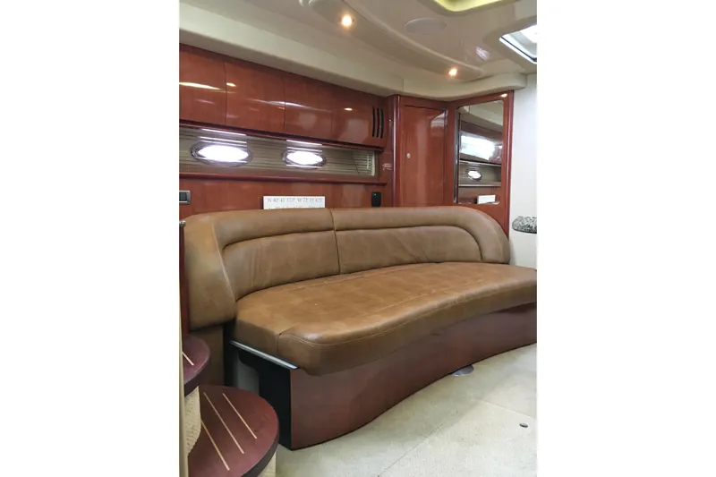  Yacht Photos Pics Luxurious interior of 2005 Sea Ray 420 Sundancer with leather seating and wood finishes.