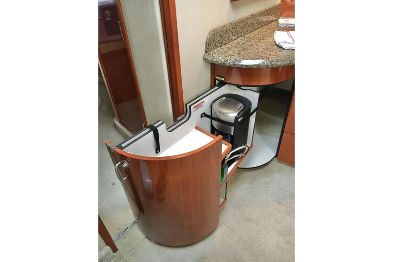  Yacht Photos Pics 2005 Sea Ray 420 Sundancer interior with pull-out cabinet and coffee maker.