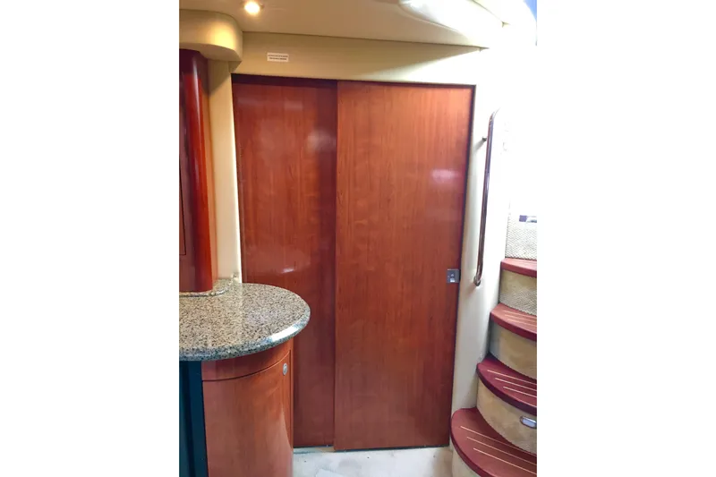  Yacht Photos Pics Interior of 2005 Sea Ray 420 Sundancer with wooden door and granite countertop.