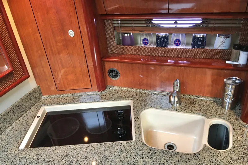  Yacht Photos Pics Luxurious 2005 Sea Ray 420 Sundancer yacht kitchen with granite countertops and modern appliances.