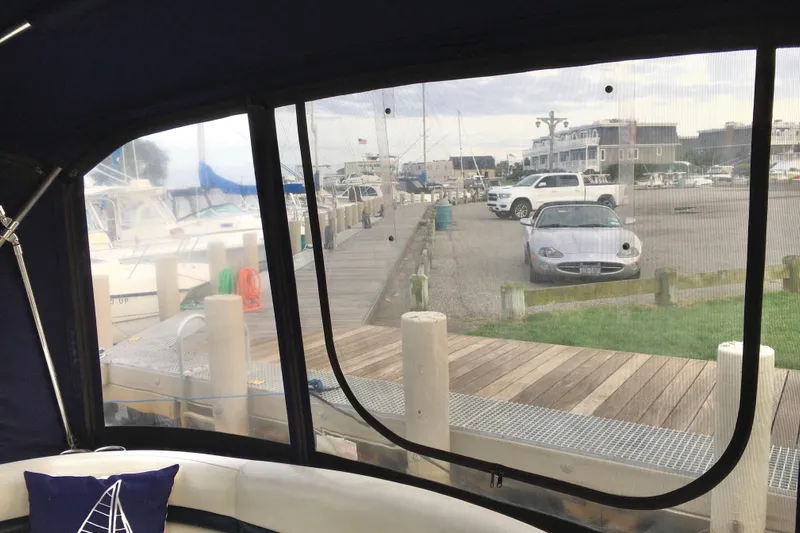  Yacht Photos Pics 2005 Sea Ray 420 Sundancer view from cabin, overlooking marina and parked cars.