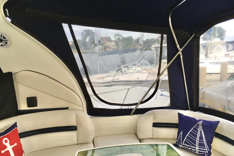  Yacht Photos Pics Interior of 2005 Sea Ray 420 Sundancer yacht with nautical-themed cushions and marina view.