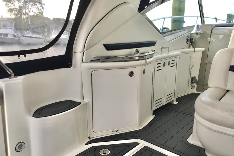  Yacht Photos Pics Interior of 2005 Sea Ray 420 Sundancer yacht, featuring sleek cabinetry and seating.