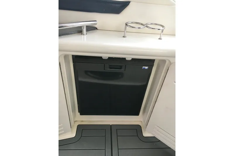  Yacht Photos Pics 2005 Sea Ray 420 Sundancer interior with built-in mini fridge and cup holders.