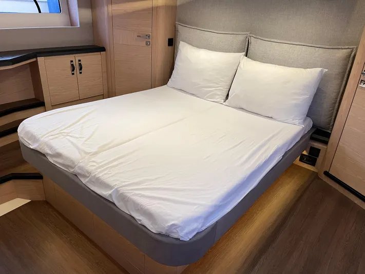  Yacht Photos Pics Luxurious bedroom interior of 2022 Beneteau Monte Carlo 52 yacht with modern design.