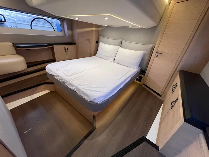  Yacht Photos Pics Luxurious cabin interior of 2022 Beneteau Monte Carlo 52 yacht with modern furnishings.
