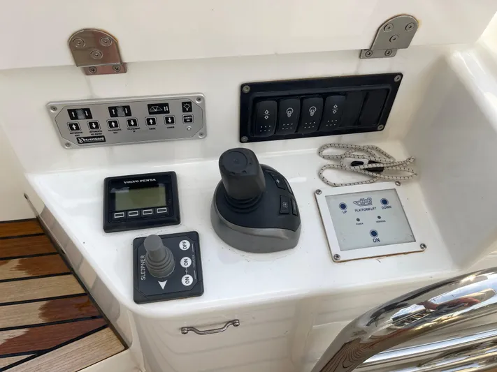  Yacht Photos Pics Control panel of 2022 Beneteau Monte Carlo 52 yacht with joystick and switches.