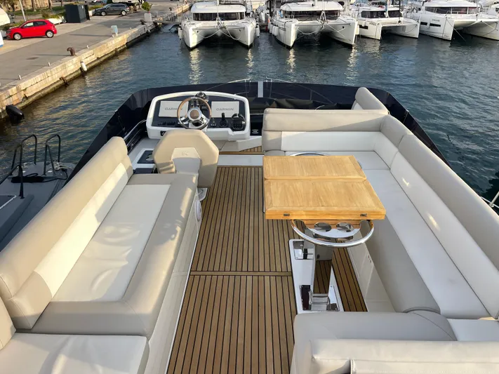 Yacht Photos Pics Luxurious 2022 Beneteau Monte Carlo 52 yacht with spacious deck and elegant seating area.