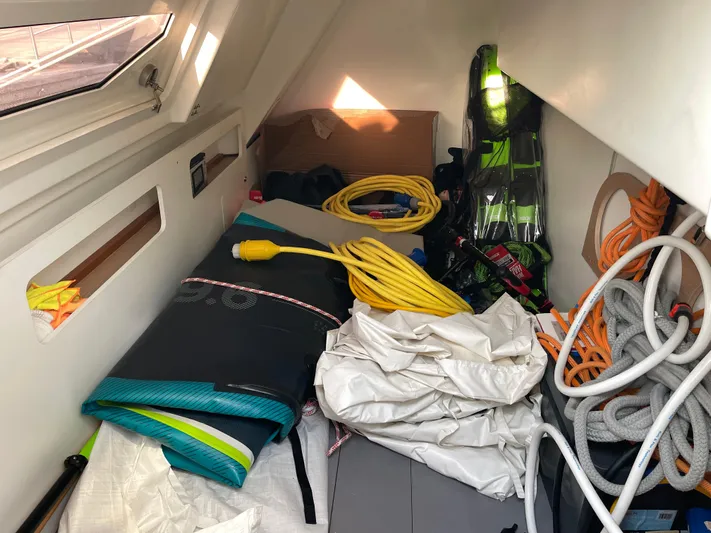  Yacht Photos Pics Interior storage of 2022 Beneteau Monte Carlo 52 with ropes and equipment.