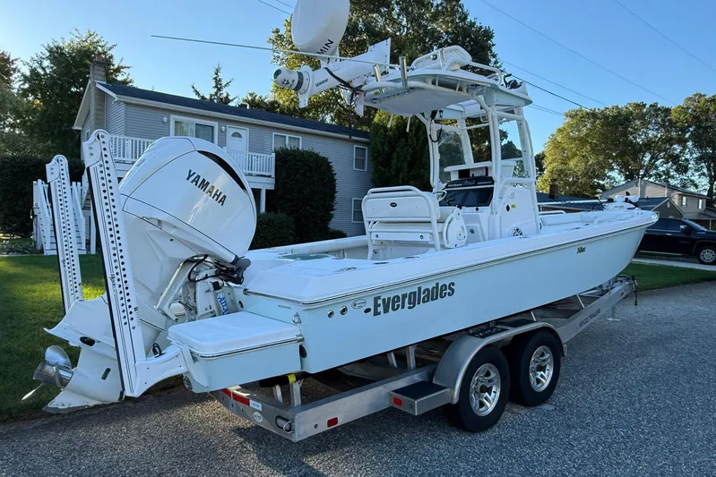  Yacht Photos Pics 2023 Everglades 243 Center Console boat on trailer, featuring Yamaha engine.