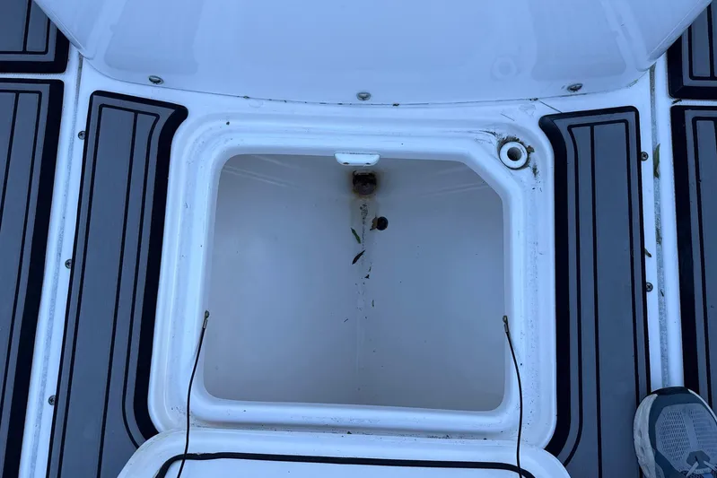  Yacht Photos Pics Open storage compartment on 2023 Everglades 243 Center Console boat deck.