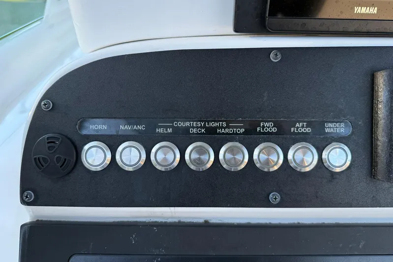  Yacht Photos Pics Control panel of 2023 Everglades 243 Center Console boat with labeled buttons.