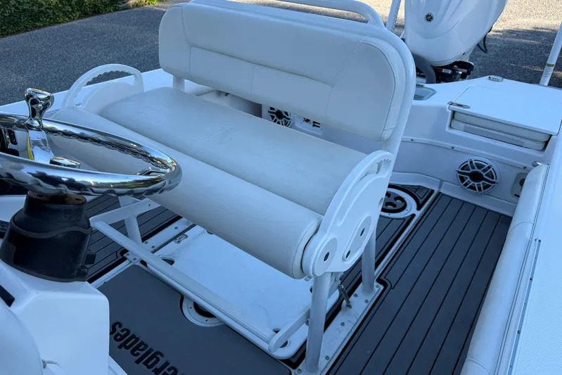  Yacht Photos Pics 2023 Everglades 243 Center Console boat interior with steering wheel and seating.