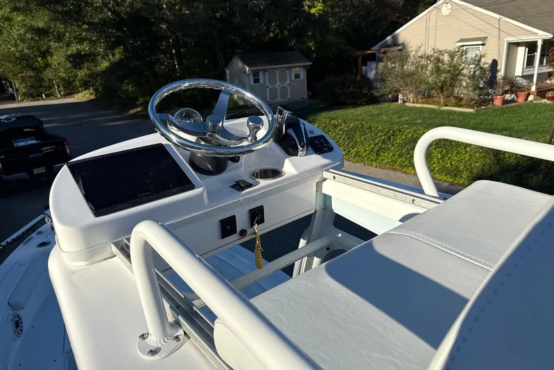  Yacht Photos Pics 2023 Everglades 243 Center Console boat helm with steering wheel and controls.