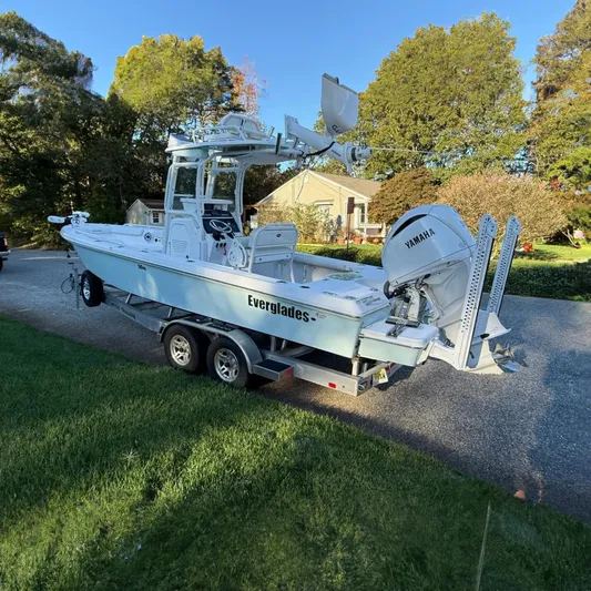  Yacht Photos Pics 2023 Everglades 243 Center Console boat on trailer, featuring Yamaha engine.
