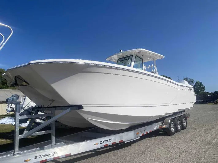 Black Label Marine Yacht Photos Pics 2025 Caymas 34 CT boat on trailer under clear blue sky.