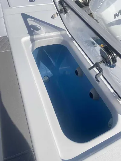 Black Label Marine Yacht Photos Pics 2025 Caymas 34 CT boat livewell with open lid, showcasing interior design.