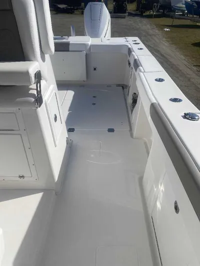 Cat Outta Hell Yacht Photos Pics 2025 Caymas 34 CT boat deck with seating and storage compartments.