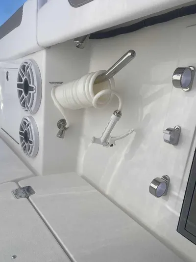 Cat Outta Hell Yacht Photos Pics 2025 Caymas 34 CT boat deck with coiled hose and speakers.