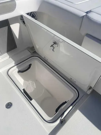 Black Label Marine Yacht Photos Pics Open storage compartment on 2025 Caymas 34 CT boat, featuring sleek design and durable materials.