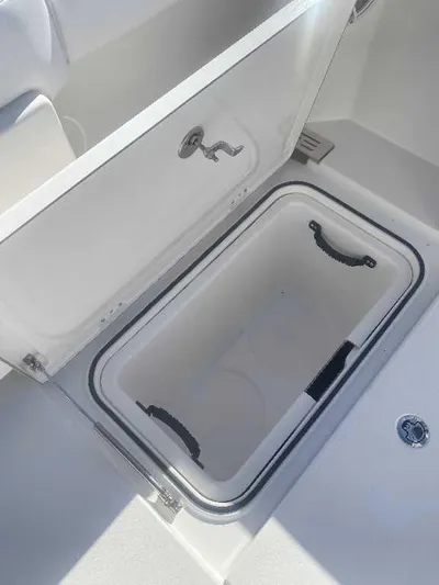 Black Label Marine Yacht Photos Pics 2025 Caymas 34 CT boat storage compartment with open lid and handles.