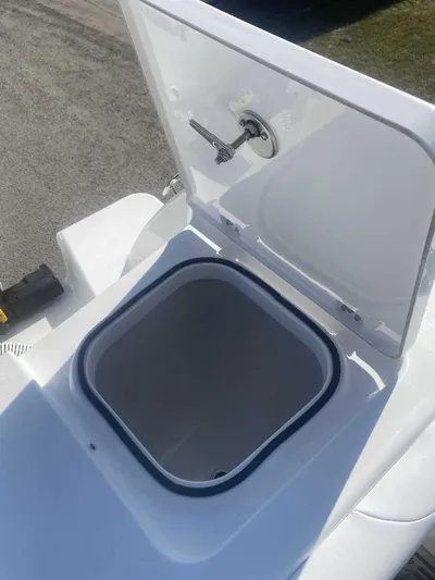 Cat Outta Hell Yacht Photos Pics Open storage compartment on 2025 Caymas 34 CT boat, featuring a sleek white design.