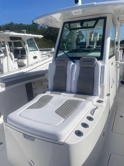 Black Label Marine Yacht Photos Pics 2025 Caymas 34 CT boat with cushioned seating and modern design.