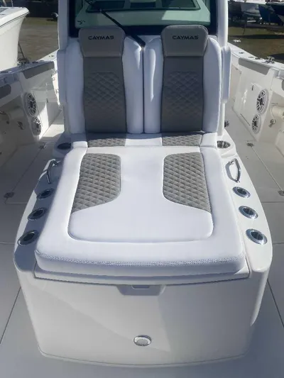 Cat Outta Hell Yacht Photos Pics 2025 Caymas 34 CT boat interior with cushioned seating and cup holders.