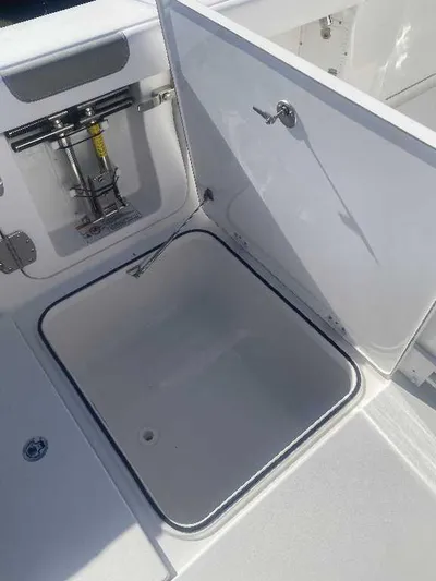 Black Label Marine Yacht Photos Pics 2025 Caymas 34 CT boat storage compartment with open hatch.