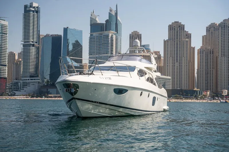 Richmind Yacht Photos Pics 2007 Azimut 68E yacht cruising near modern city skyline.