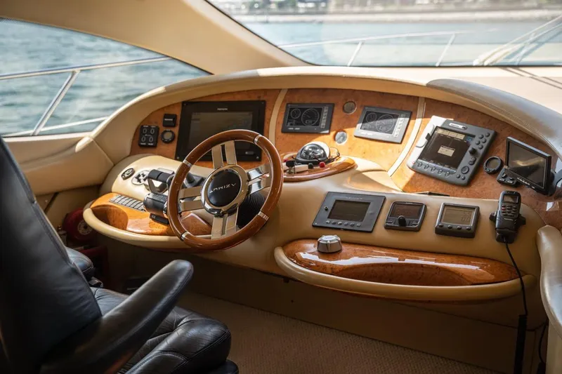 Richmind Yacht Photos Pics Luxurious 2007 Azimut 68E yacht cockpit with advanced navigation controls and leather seating.