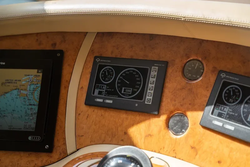Richmind Yacht Photos Pics Dashboard of a 2007 Azimut 68E yacht with navigation and engine displays.