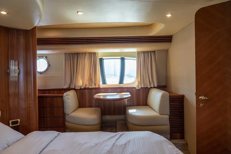 Richmind Yacht Photos Pics Luxurious interior of 2007 Azimut 68E yacht with elegant seating and window view.