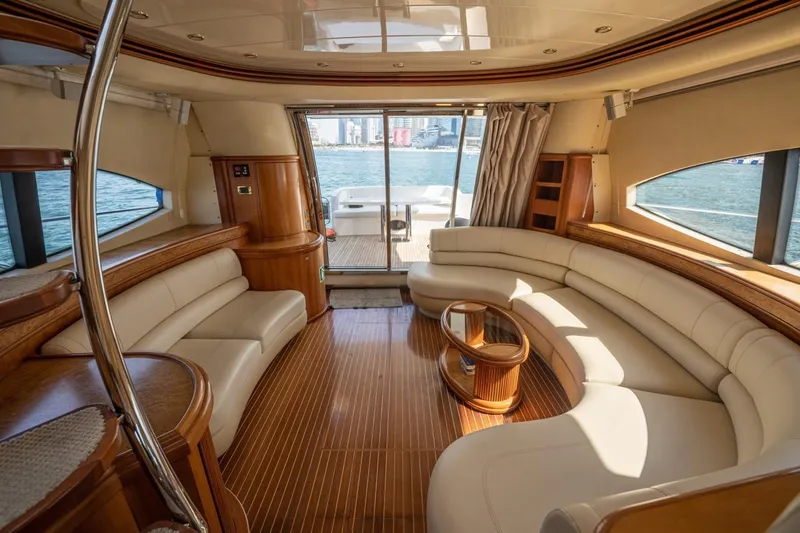 Richmind Yacht Photos Pics Luxurious interior of 2007 Azimut 68E yacht with elegant seating and panoramic windows.