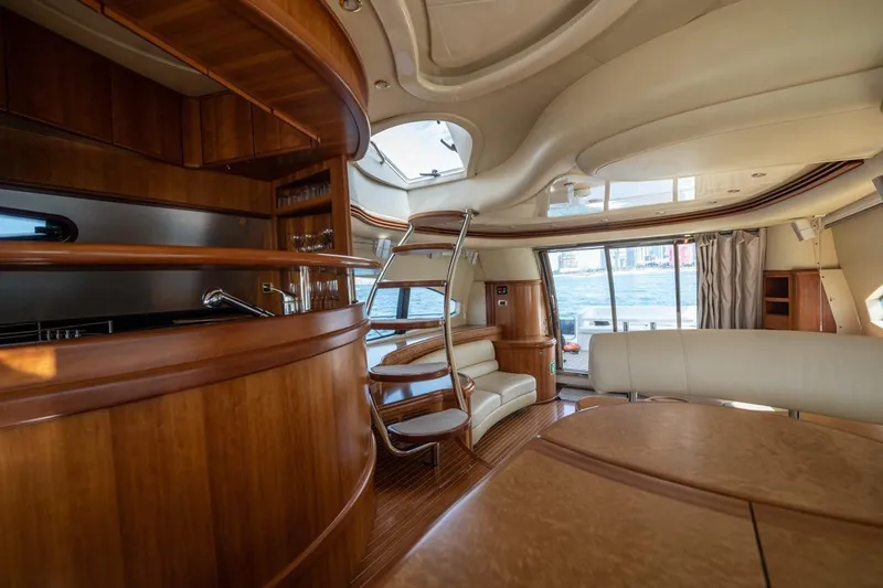 Richmind Yacht Photos Pics Luxurious interior of 2007 Azimut 68E yacht with elegant wood finishes and modern design.