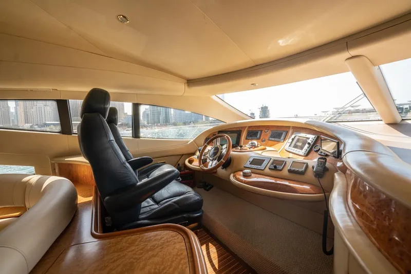 Richmind Yacht Photos Pics Luxurious interior of a 2007 Azimut 68E yacht cockpit with leather seating and navigation controls.