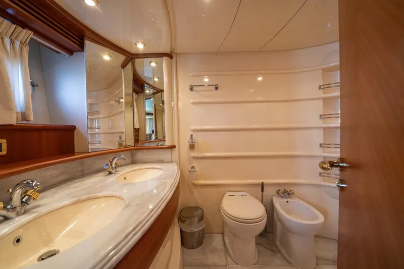 Richmind Yacht Photos Pics Luxurious bathroom in 2007 Azimut 68E yacht with dual sinks and elegant fixtures.