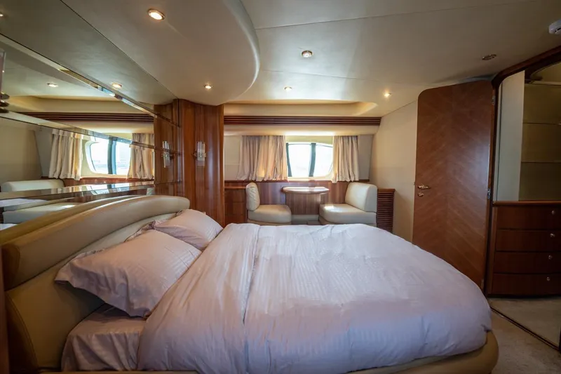 Richmind Yacht Photos Pics Luxurious bedroom interior of 2007 Azimut 68E yacht with elegant furnishings.