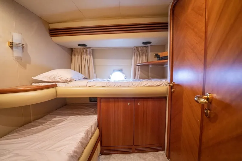 Richmind Yacht Photos Pics 2007 Azimut 68E yacht cabin with bunk beds and wooden interior.