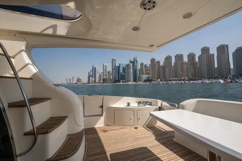Richmind Yacht Photos Pics Luxurious 2007 Azimut 68E yacht with city skyline view, elegant deck design.