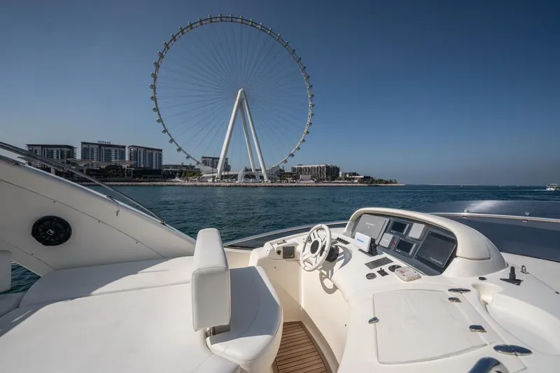 Richmind Yacht Photos Pics 2007 Azimut 68E yacht with city skyline and Ferris wheel in the background.