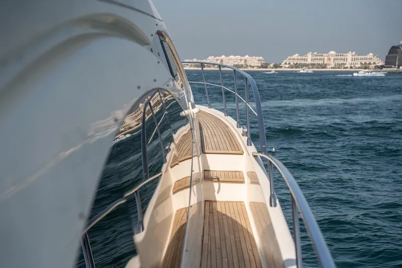 Richmind Yacht Photos Pics 2007 Azimut 68E yacht deck with ocean view and distant buildings.